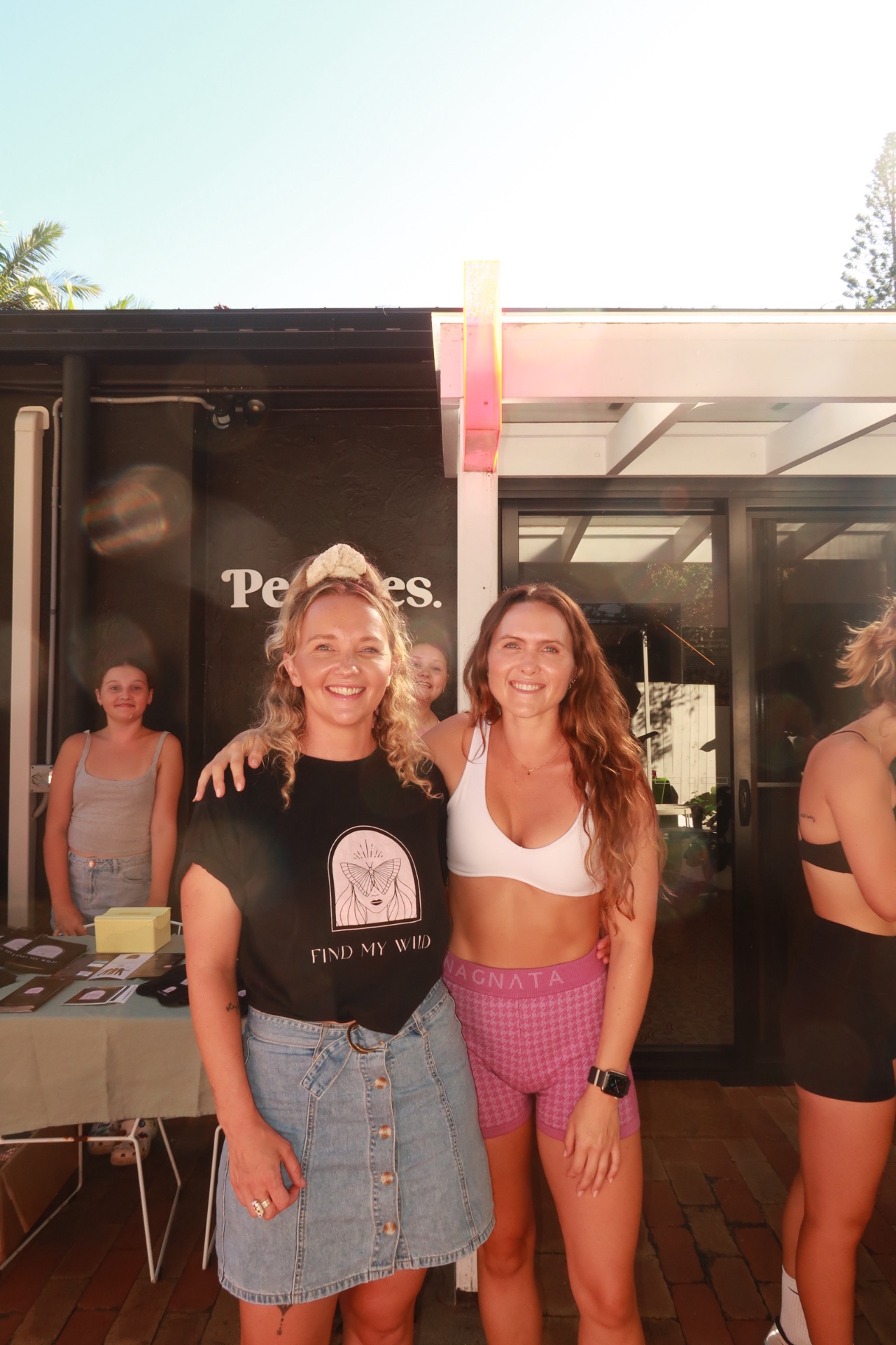 Lauren Jane in a Find My Wild tee with a community member