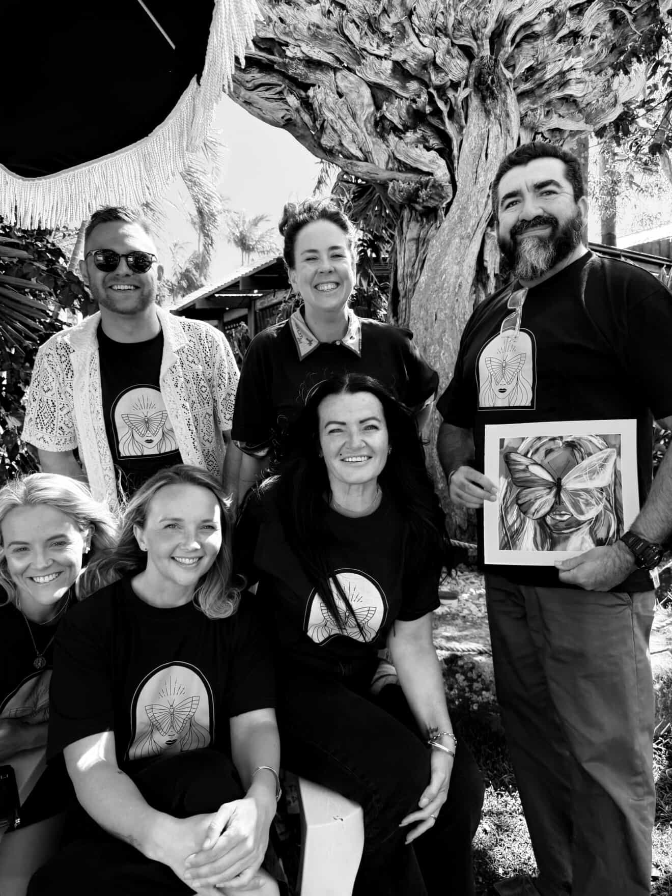 Black and white portrait of the Find My Wild team in matching tees
